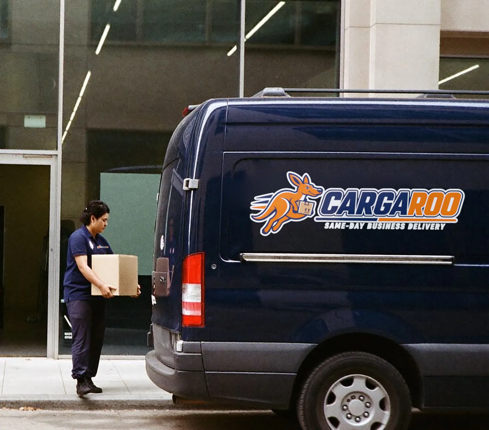 Cargaroo courier loading a parcel into a delivery van
